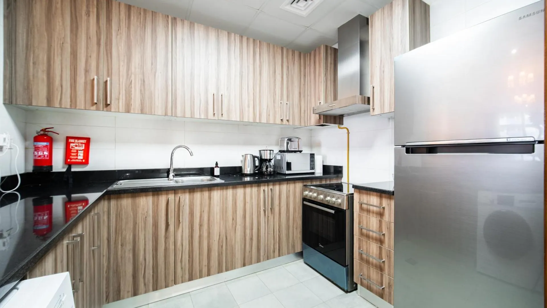 Elegant Escapes - Homely 1B In Dunya Tower Dubai